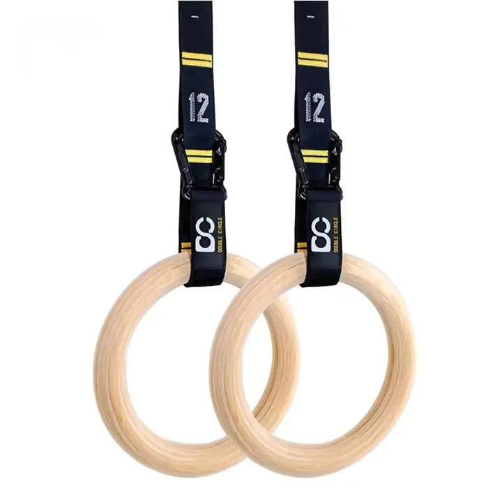 Anneaux de gymnastique en bois de 32 mm avec sangles numérotées à réglage rapide pour un contrôle amélioré de l'exercice