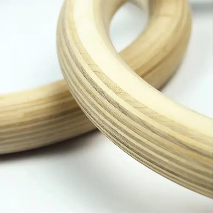 Anneaux de gymnastique en bois de 32 mm avec sangles numérotées à réglage rapide pour un contrôle amélioré de l'exercice