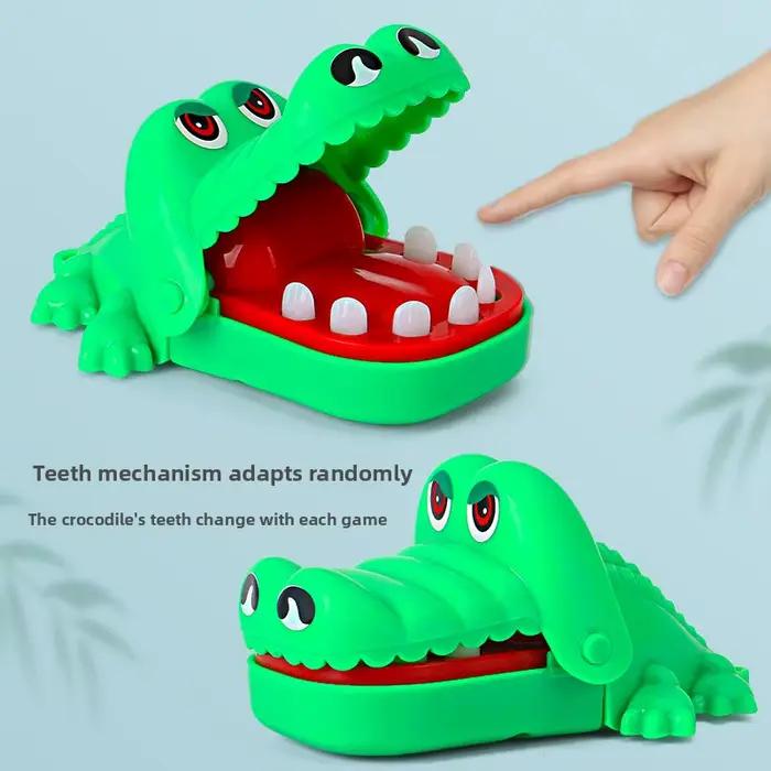 Jouet de dentiste alligator mordant le doigt