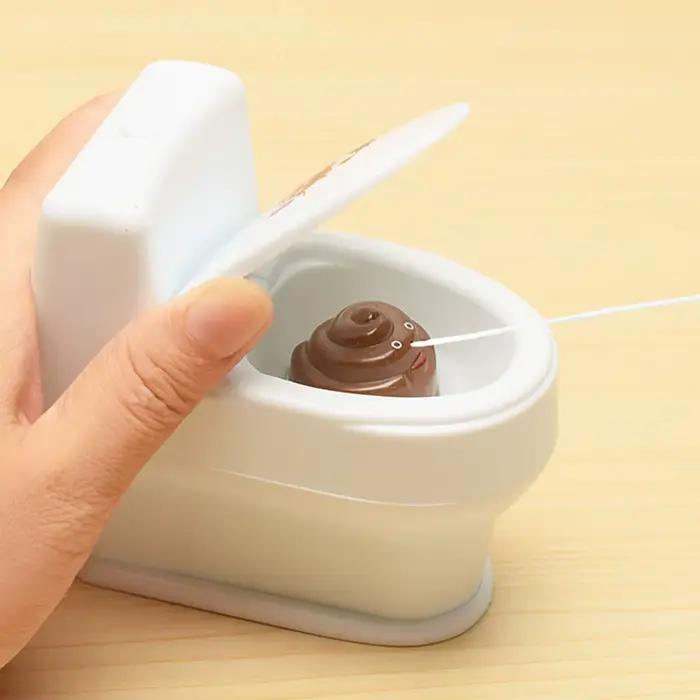 1PC-nouveau intéressant merde Spray farce jouet blague culinaire jouets Mini arroseur toilette pistolet Simulation